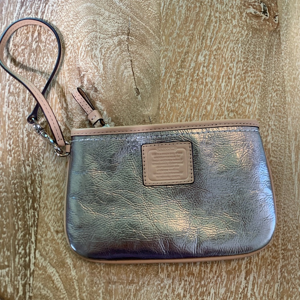 Genuine COACH leather wristlet. Metallic silver and buff leather. NWOT.